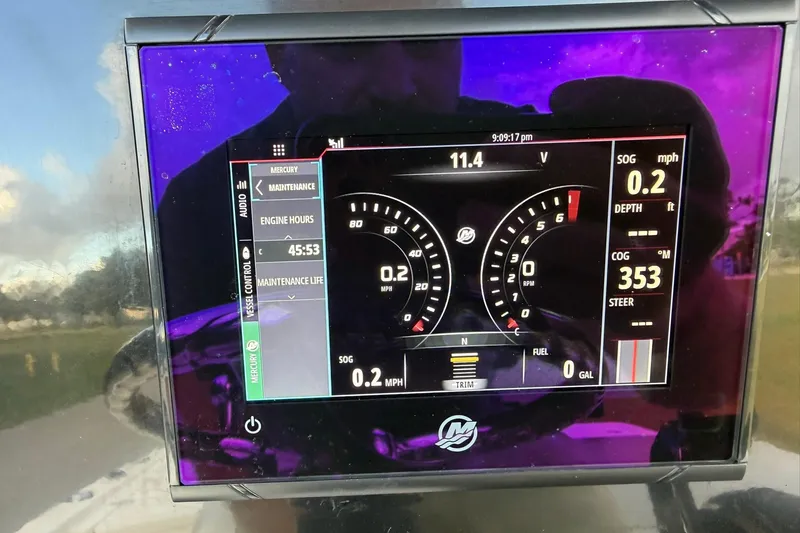 Slide: The Image of Dashboard display of a 2019 Wellcraft 241 Bay boat showing engine metrics and navigation data. - 18
