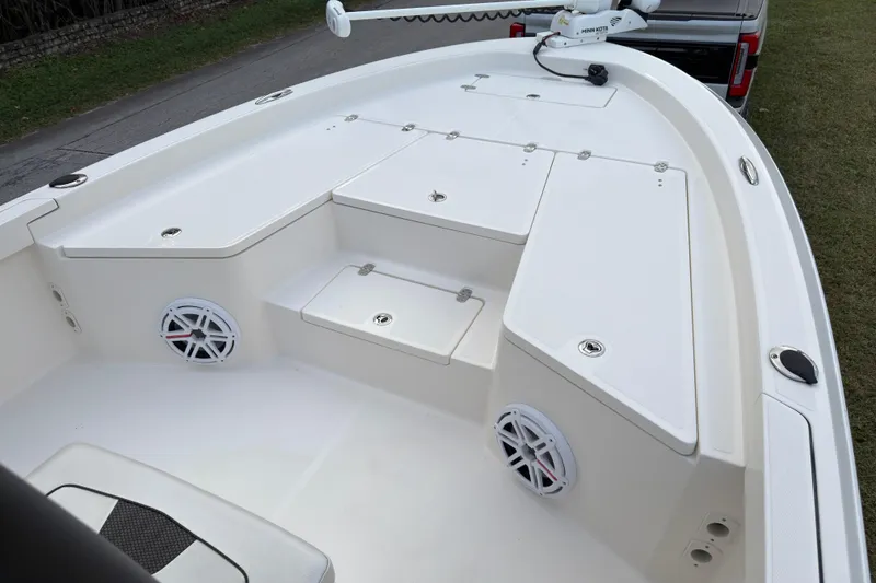 Slide: The Image of 2019 Wellcraft 241 Bay boat interior with storage compartments and speakers. - 22