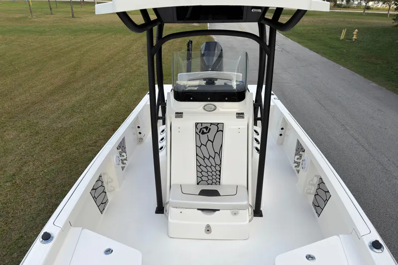 Slide: The Image of 2019 Wellcraft 241 Bay boat interior with modern console design and spacious deck. - 24