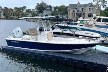 The Image of 2022 Seapro 228 Bay boat docked in a scenic waterfront setting. - 1