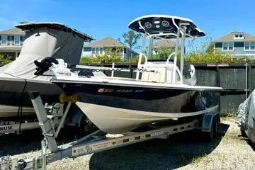 Slide: The Image of 2022 Seapro 228 Bay boat on trailer, parked outdoors in a residential area. - 14