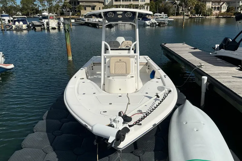 Slide: The Image of 2022 Seapro 228 Bay boat docked at marina, featuring sleek design and modern amenities. - 22