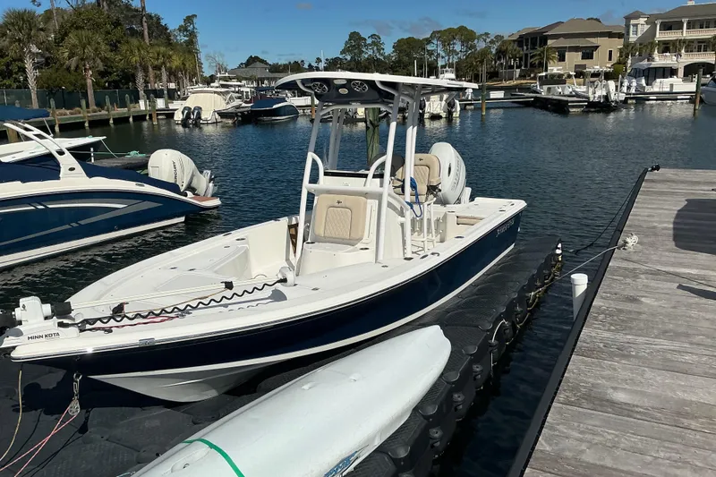 Slide: The Image of 2022 Seapro 228 Bay boat docked at a marina with clear skies. - 23