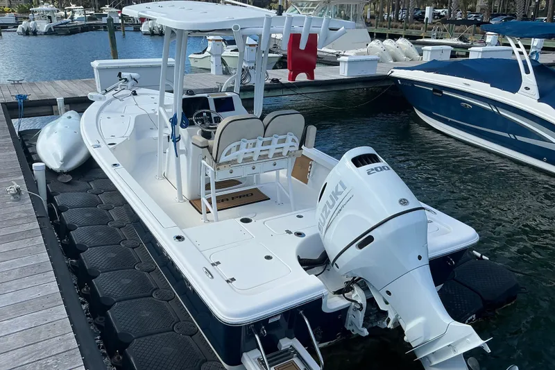 Slide: The Image of 2022 Seapro 228 Bay boat docked with Suzuki 200 outboard engine. - 27