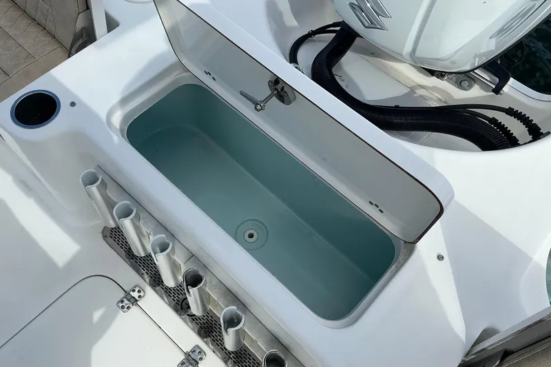 Slide: The Image of 2022 Seapro 228 Bay boat with open livewell and rod holders. - 31