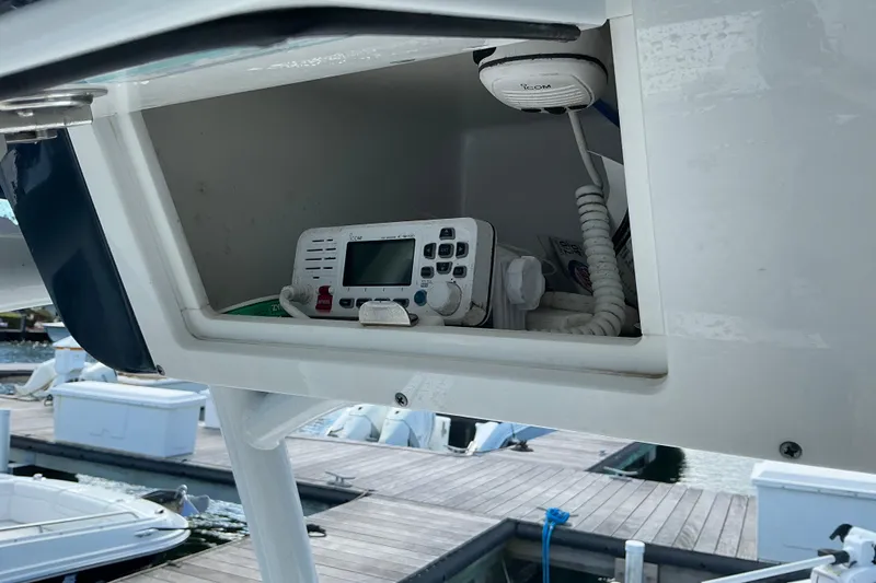 Slide: The Image of 2022 Seapro 228 Bay boat with marine radio in storage compartment at dock. - 34
