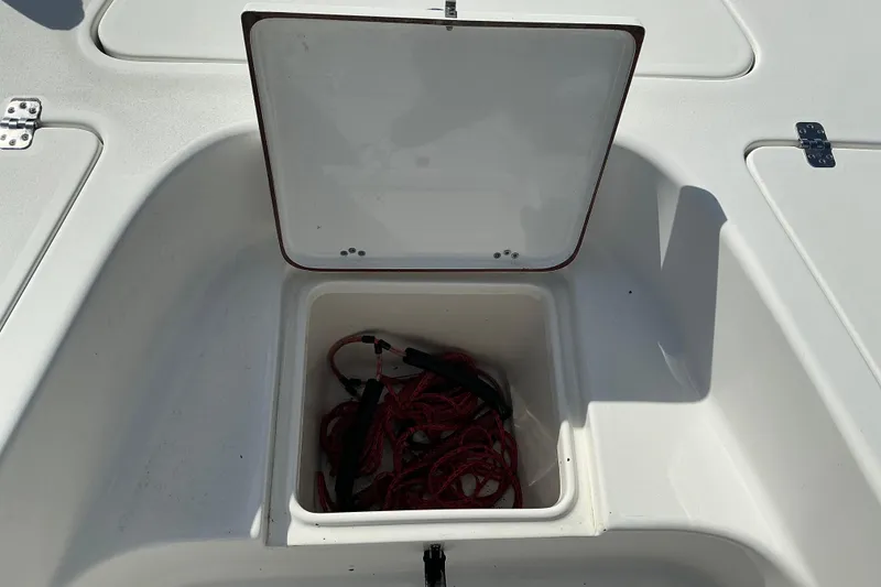 Slide: The Image of Open storage compartment on 2022 Seapro 228 Bay boat with red rope inside. - 38
