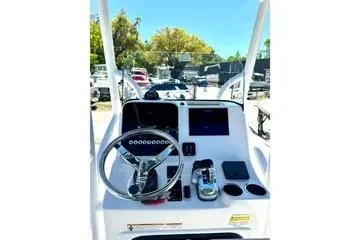 Slide: The Image of 2022 Seapro 228 Bay boat console with steering wheel and controls. - 7