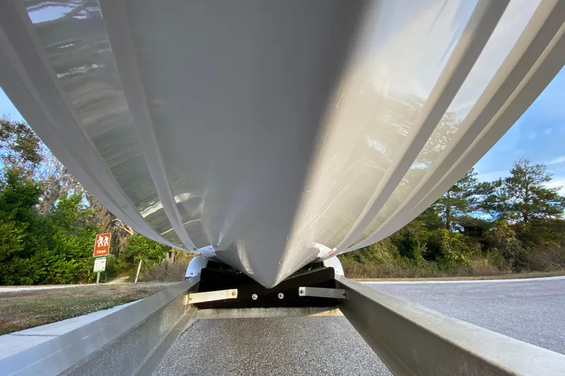 Slide: The Image of Underneath view of a 2020 Pathfinder 2500 Hybrid boat on a trailer. - 13