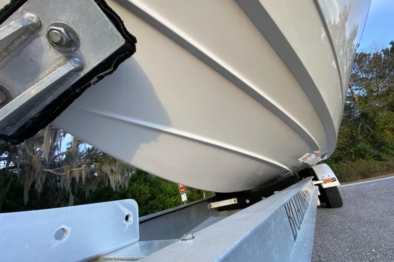Slide: The Image of 2020 Pathfinder 2500 Hybrid boat on trailer, close-up view of hull and trailer. - 15