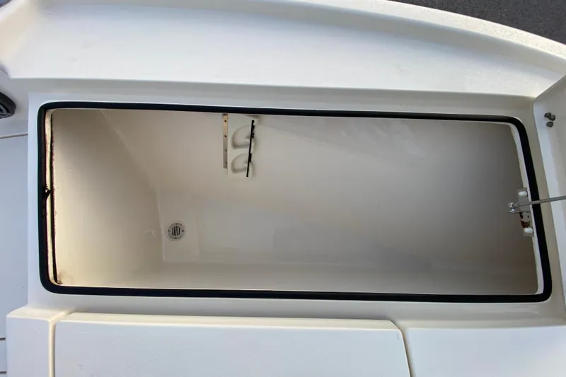 Slide: The Image of Open storage compartment on a 2020 Pathfinder 2500 Hybrid boat. - 24