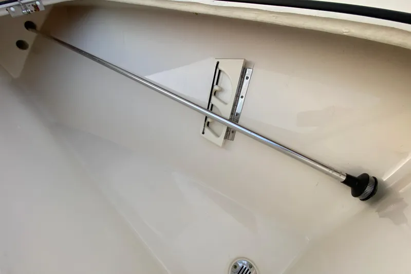 Slide: The Image of Interior of a 2020 Pathfinder 2500 Hybrid boat, featuring a storage compartment. - 30