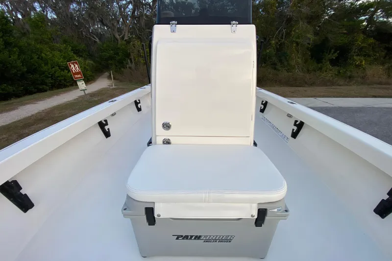 Slide: The Image of 2020 Pathfinder 2500 Hybrid boat interior with cushioned seat and storage. - 35