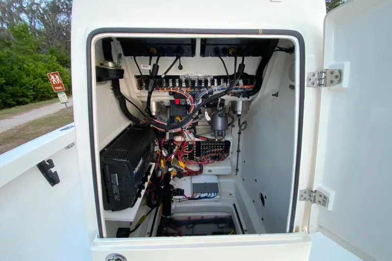 Slide: The Image of Electrical compartment of a 2020 Pathfinder 2500 Hybrid boat, showcasing wiring and components. - 38