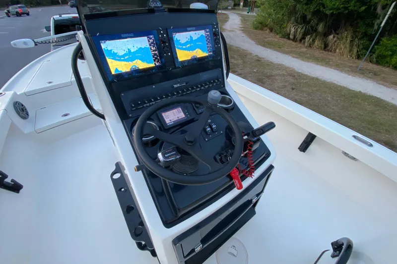 Slide: The Image of 2020 Pathfinder 2500 Hybrid boat console with dual Simrad displays and steering wheel. - 42