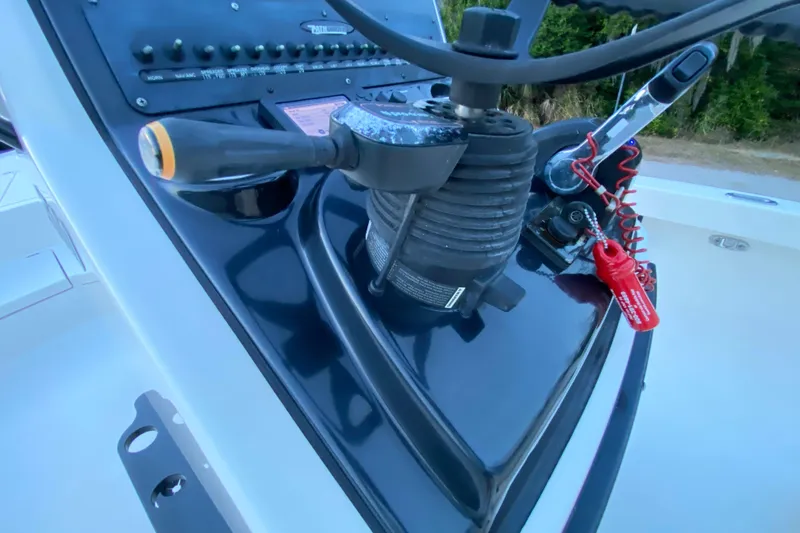 Slide: The Image of Close-up of 2020 Pathfinder 2500 Hybrid boat controls and steering wheel. - 45