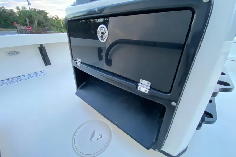 Slide: The Image of 2020 Pathfinder 2500 Hybrid boat console with storage compartment and cup holder. - 46