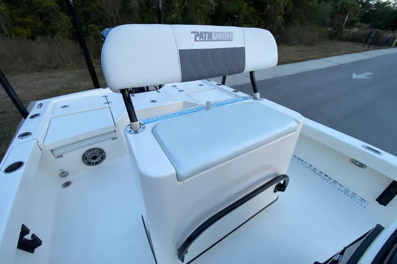 Slide: The Image of 2020 Pathfinder 2500 Hybrid boat interior with cushioned seating and storage compartments. - 48