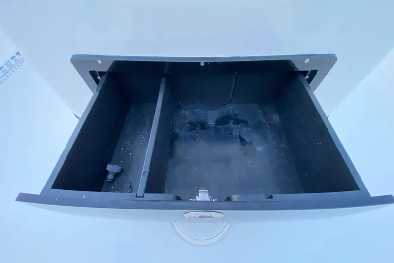 Slide: The Image of Open storage compartment in a 2020 Pathfinder 2500 Hybrid boat. - 53