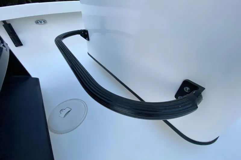 Slide: The Image of 2020 Pathfinder 2500 Hybrid boat interior with black handle and storage compartment. - 54