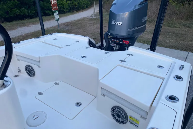 Slide: The Image of 2020 Pathfinder 2500 Hybrid boat with Yamaha 300 engine, docked near a trail sign. - 55