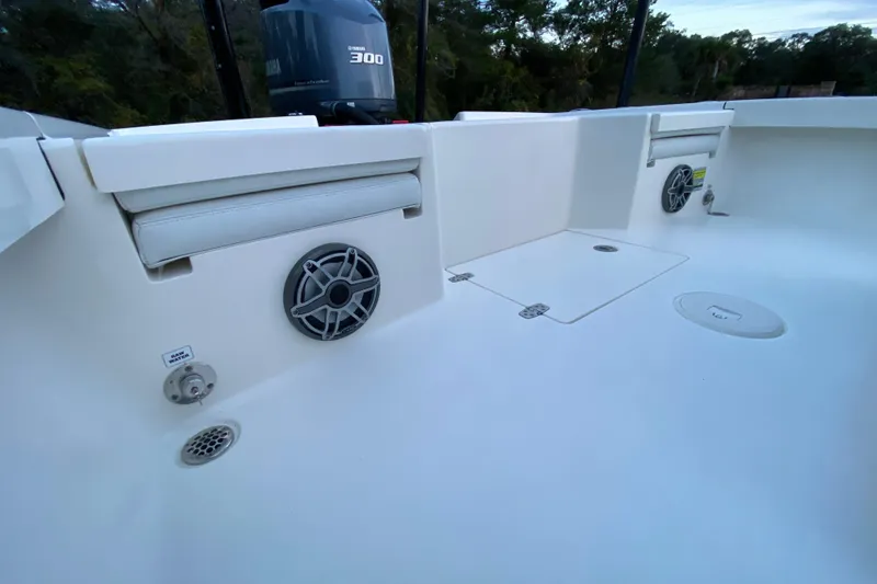 Slide: The Image of 2020 Pathfinder 2500 Hybrid boat interior with Yamaha 300 engine, featuring speakers and storage compartments. - 60