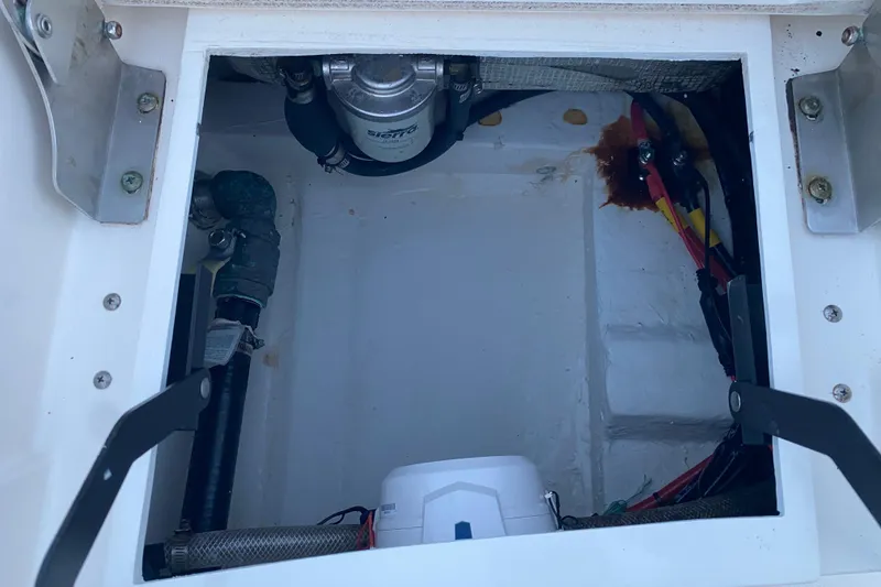 Slide: The Image of 2020 Pathfinder 2500 Hybrid boat compartment with visible wiring and components. - 64