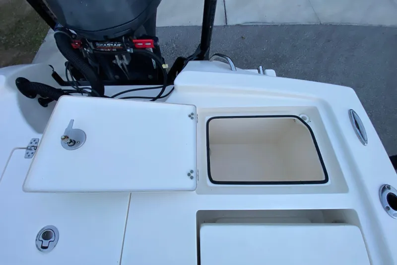 Slide: The Image of Pathfinder 2500 Hybrid 2020 boat deck with storage compartments and engine view. - 73