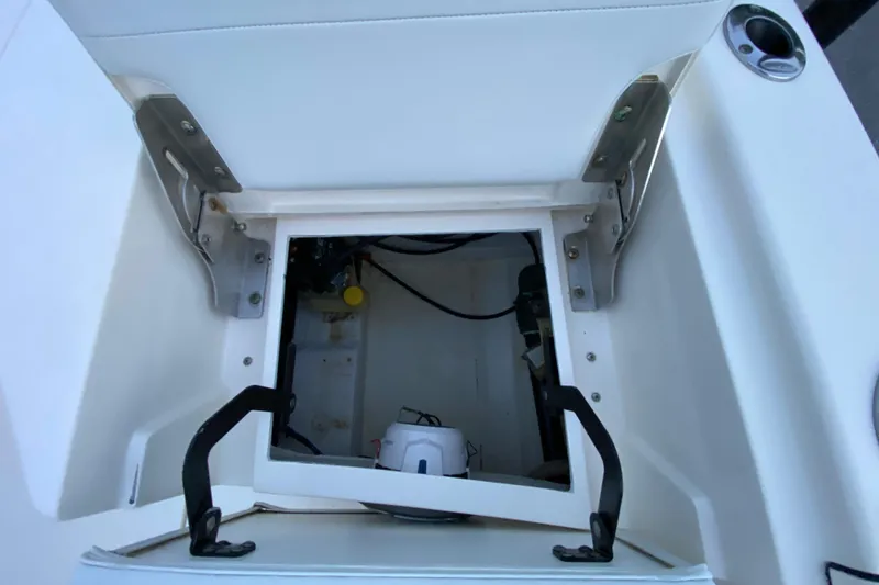 Slide: The Image of Open storage compartment in 2020 Pathfinder 2500 Hybrid boat, showcasing interior details. - 75