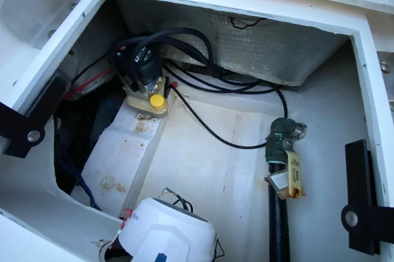 Slide: The Image of 2020 Pathfinder 2500 Hybrid boat compartment with pump and wiring. - 76