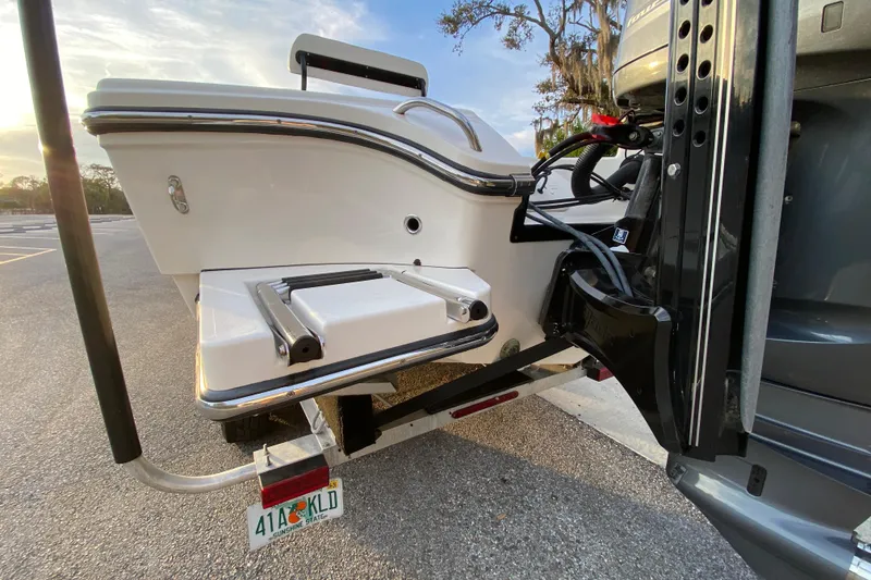 Slide: The Image of Rear view of a 2020 Pathfinder 2500 Hybrid boat with ladder and motor. - 8
