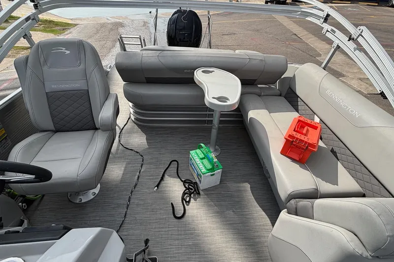Slide: The Image of 2023 Bennington 23 SXSB pontoon boat interior with gray seating and accessories. - 11
