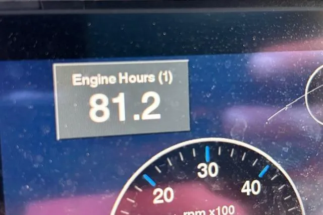 Slide: The Image of Dashboard display showing 81.2 engine hours on 2023 Bennington 23 SXSB. - 18