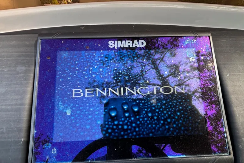 Slide: The Image of Simrad display on 2023 Bennington 23 SXSB boat, showing brand logo. - 19