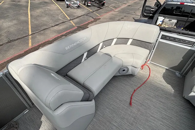 Slide: The Image of 2023 Bennington 23 SXSB pontoon boat with luxurious gray seating and modern design. - 9