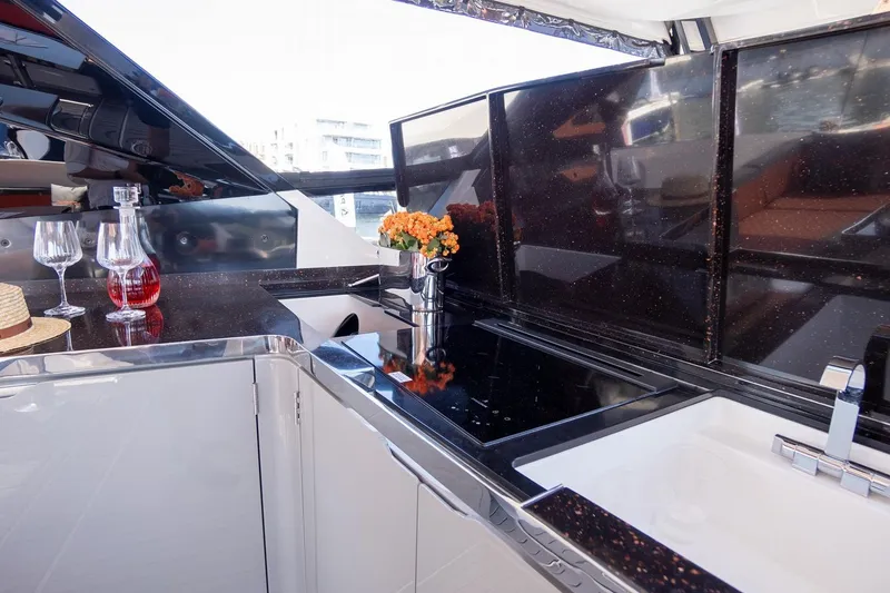 Slide: The Image of Luxurious kitchen area on 2026 Dracan 42 Catamaran with sleek countertops and elegant decor. - 11