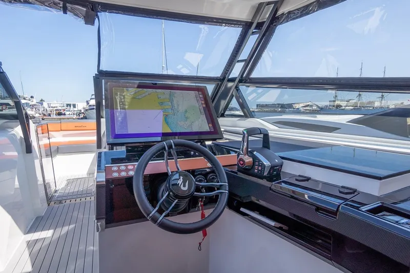 Slide: The Image of Modern helm of 2026 Dracan 42 Catamaran with navigation display and controls. - 15