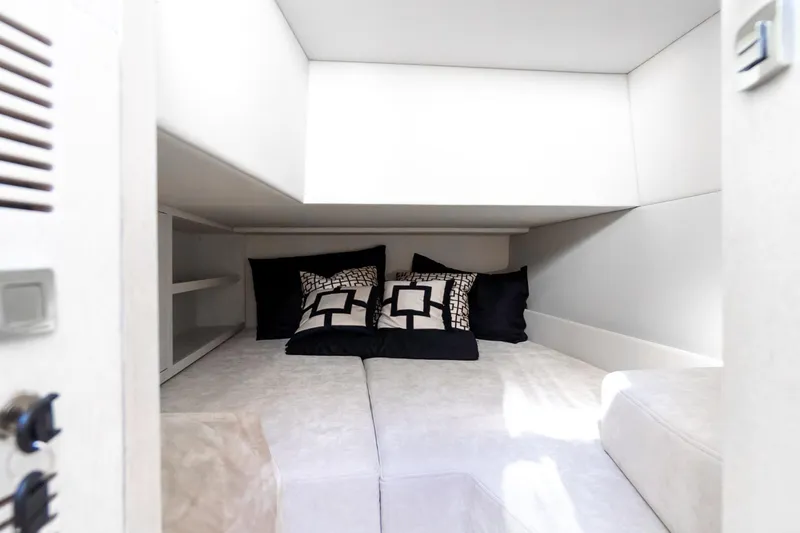 Slide: The Image of Luxurious cabin interior of 2026 Dracan 42 Catamaran with modern bedding and storage. - 23