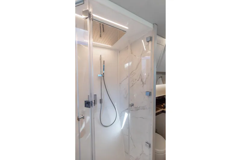Slide: The Image of Luxurious shower in 2026 Dracan 42 Catamaran with marble walls and modern fixtures. - 24