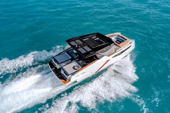 Slide: The Image of 2026 Dracan 42 Catamaran cruising on clear blue ocean waters. - 6