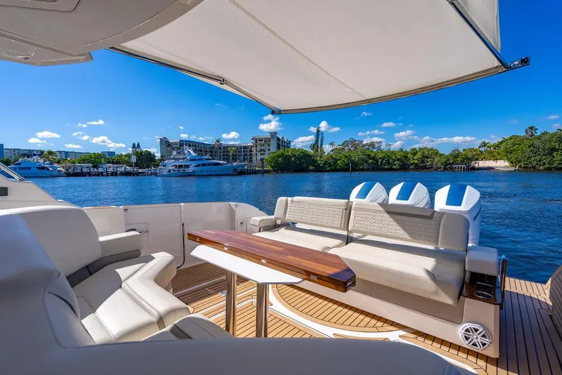 Slide: The Image of Luxurious 2024 Tiara Yachts 48 LS with spacious deck and scenic waterfront view. - 15