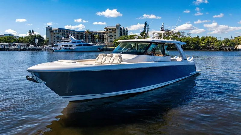 Slide: The Image of 2024 Tiara Yachts 48 LS luxury boat on calm water. - 4