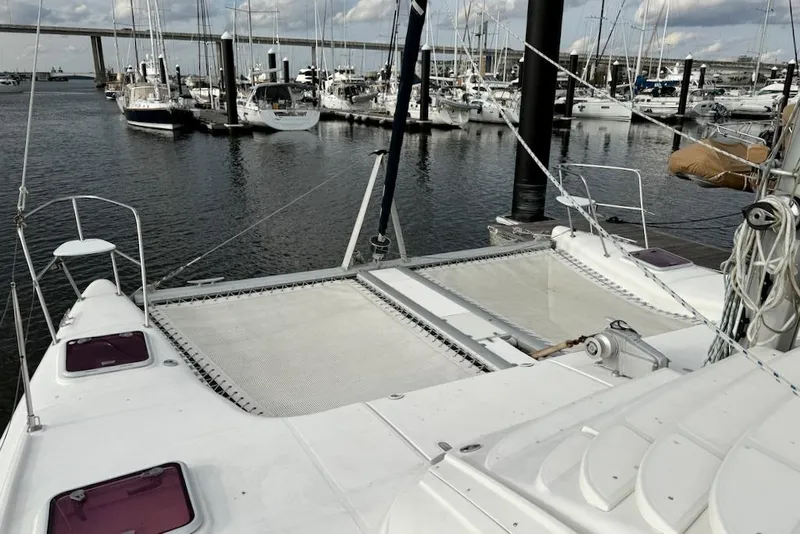 Slide: The Image of 2006 Island Spirit 401 catamaran docked at marina with other boats. - 10