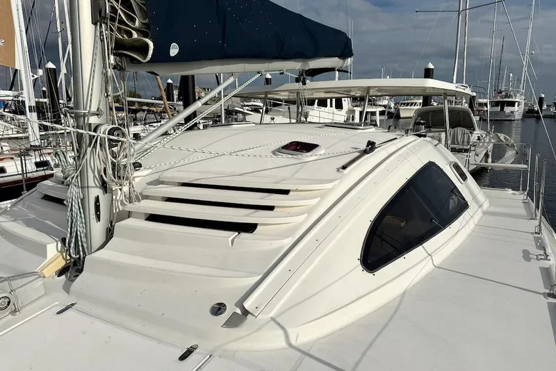 Slide: The Image of Sailboat Island Spirit 401, 2006 model, docked at marina with clear sky. - 14