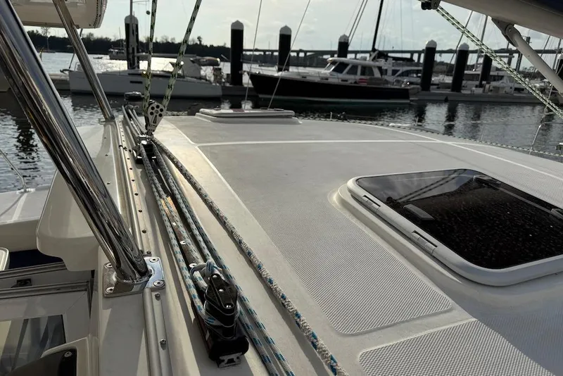 Slide: The Image of 2006 Island Spirit 401 sailboat deck with rigging, docked at marina. - 16