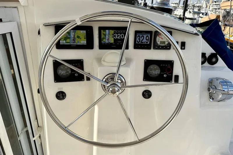 Slide: The Image of Steering wheel and dashboard of 2006 Island Spirit 401 yacht with navigation instruments. - 18