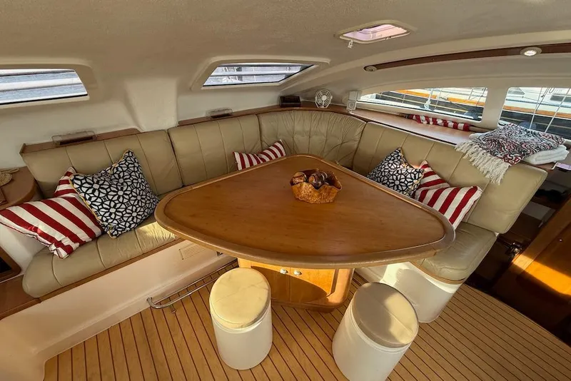 Slide: The Image of Luxurious interior of 2006 Island Spirit 401 yacht with elegant seating and decorative pillows. - 22
