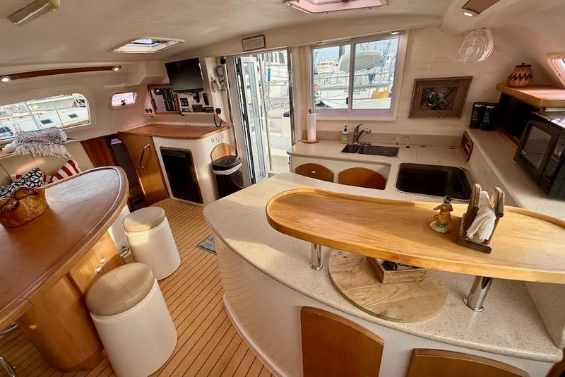 Slide: The Image of Interior of 2006 Island Spirit 401 yacht with modern kitchen and dining area. - 25