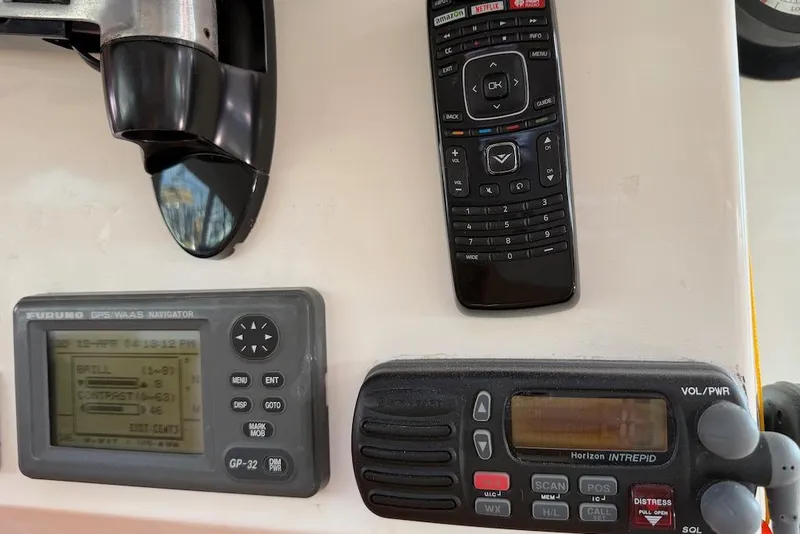 Slide: The Image of Control panel of a 2006 Island Spirit 401 with GPS, remote, and radio equipment. - 28