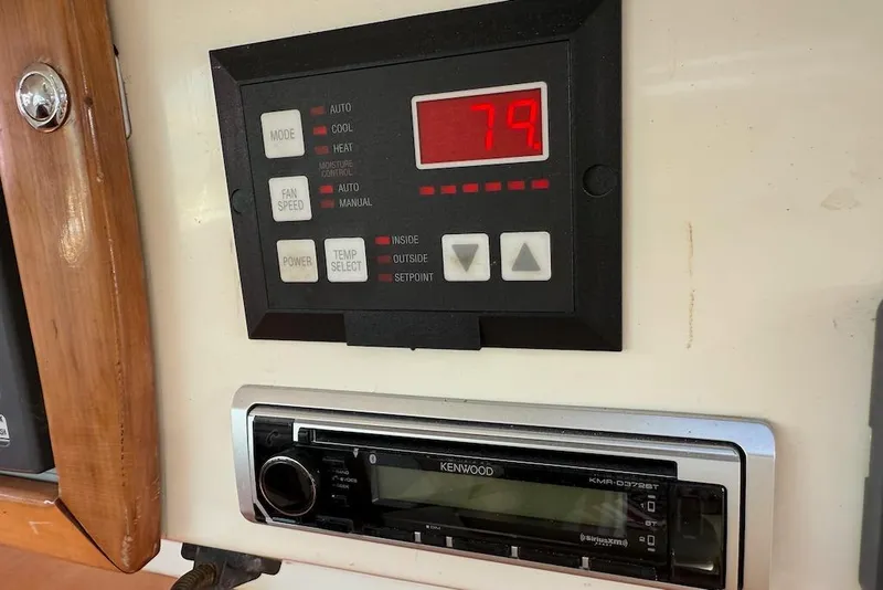 Slide: The Image of Control panel and Kenwood stereo on 2006 Island Spirit 401 yacht. - 29
